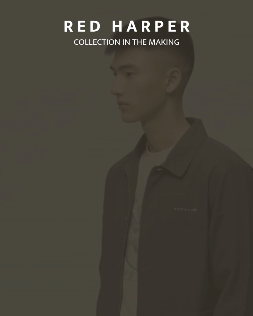 Monochrome fashion image showing a person wearing a minimalist jacket and T‑shirt, with the text “Red Harper – Collection in the Making” overlaid.